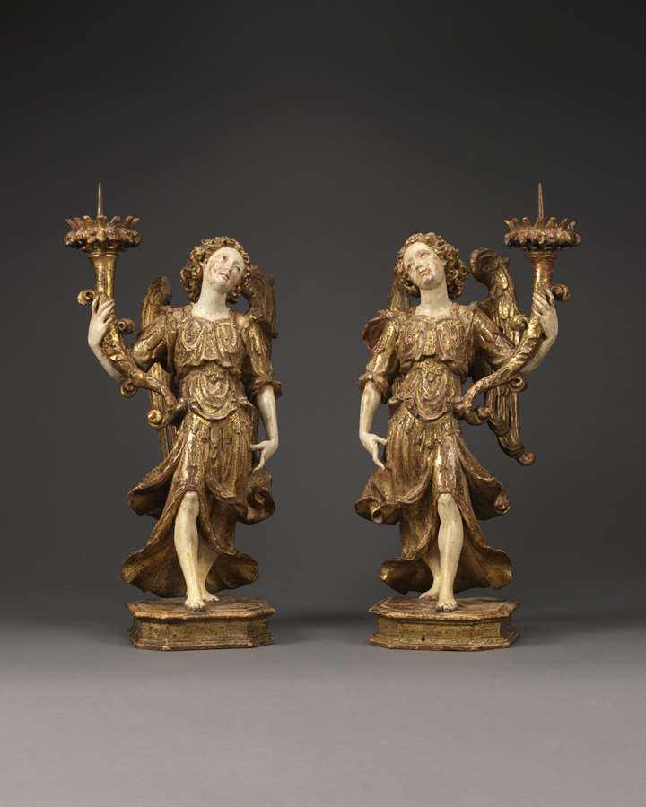 A Pair of Angels Holding Candlesticks